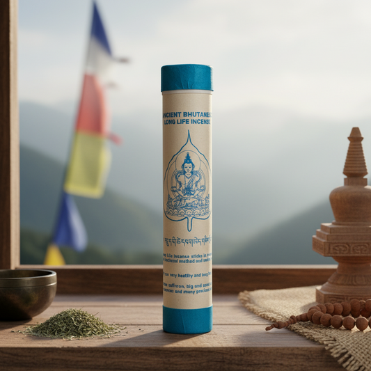 Incense stick tube with religious design on a wooden surface with blurred background