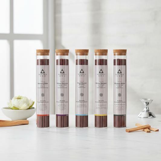 Five cylindrical incense sticks packaging on a white surface with minimal decor
