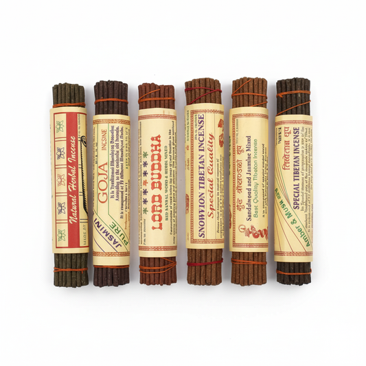 Set of six incense sticks with labels on a white background