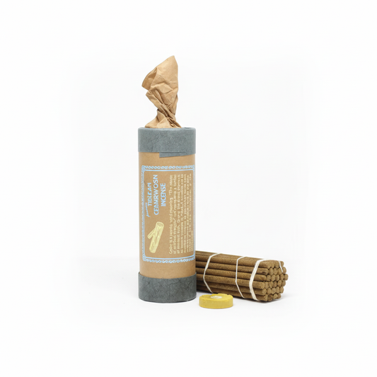 Candle and incense set with a cylindrical container on a white background