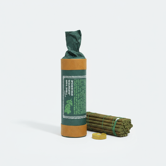 Green and brown package of incense sticks on a white background