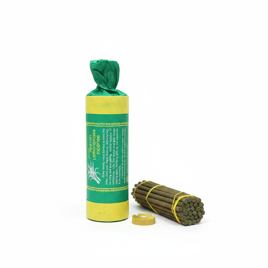 Green and yellow package with a bundle of sticks on a white background