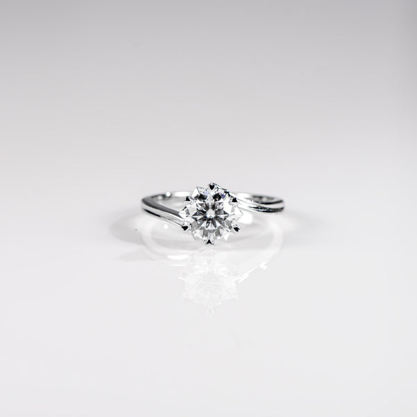 Diamond ring on a light gray background