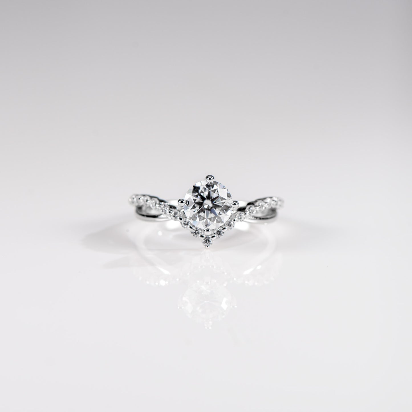 Diamond ring on a light gray background