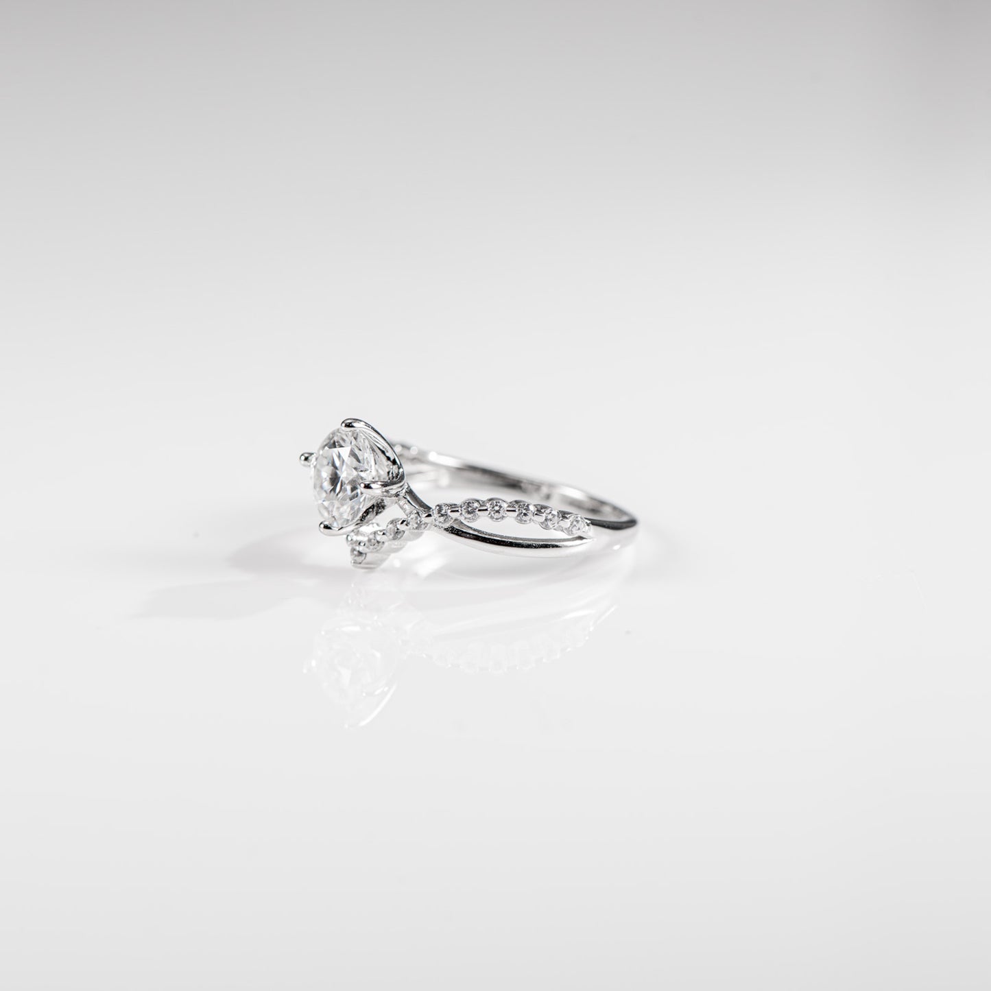 Diamond ring on a light gray background