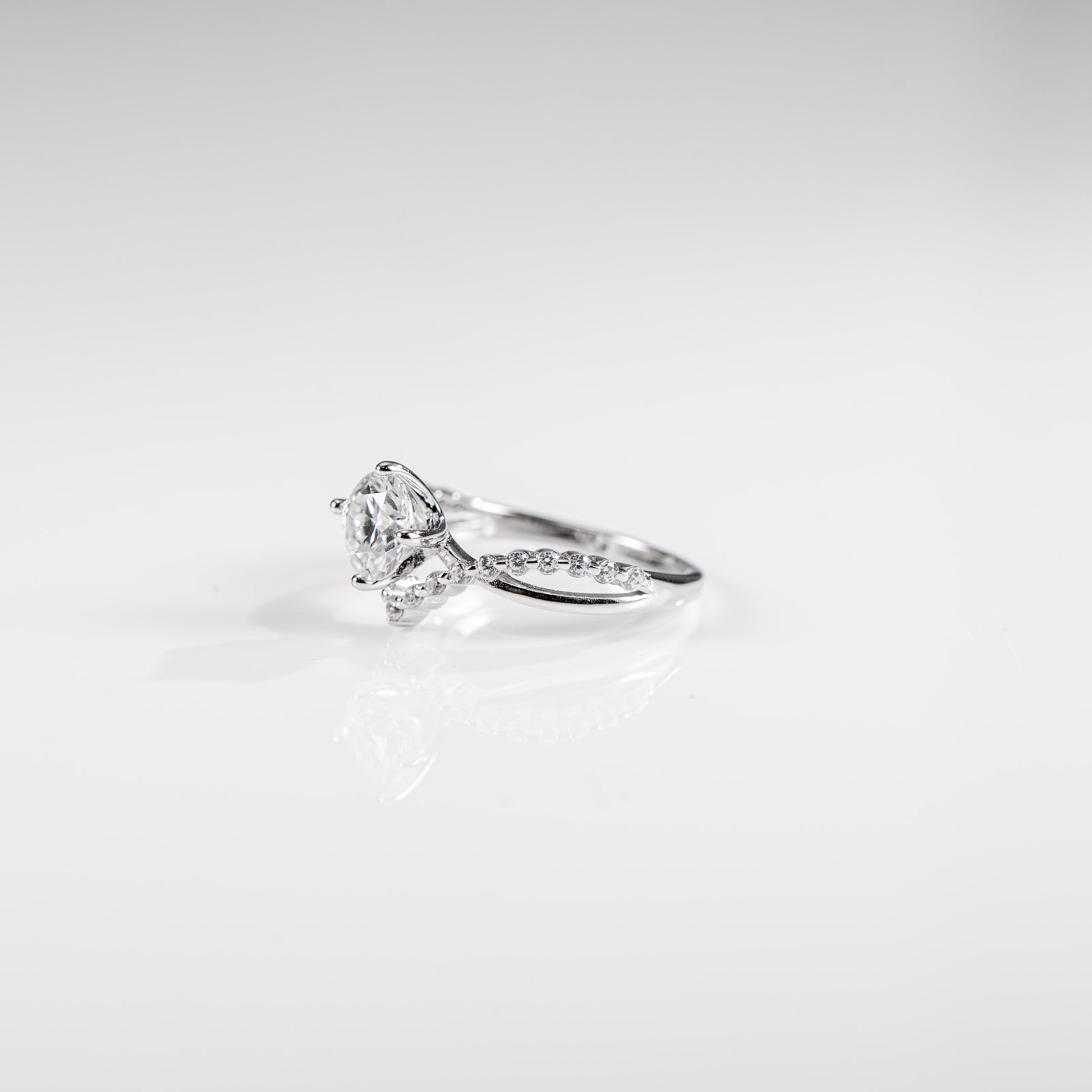 Diamond ring on a light gray background