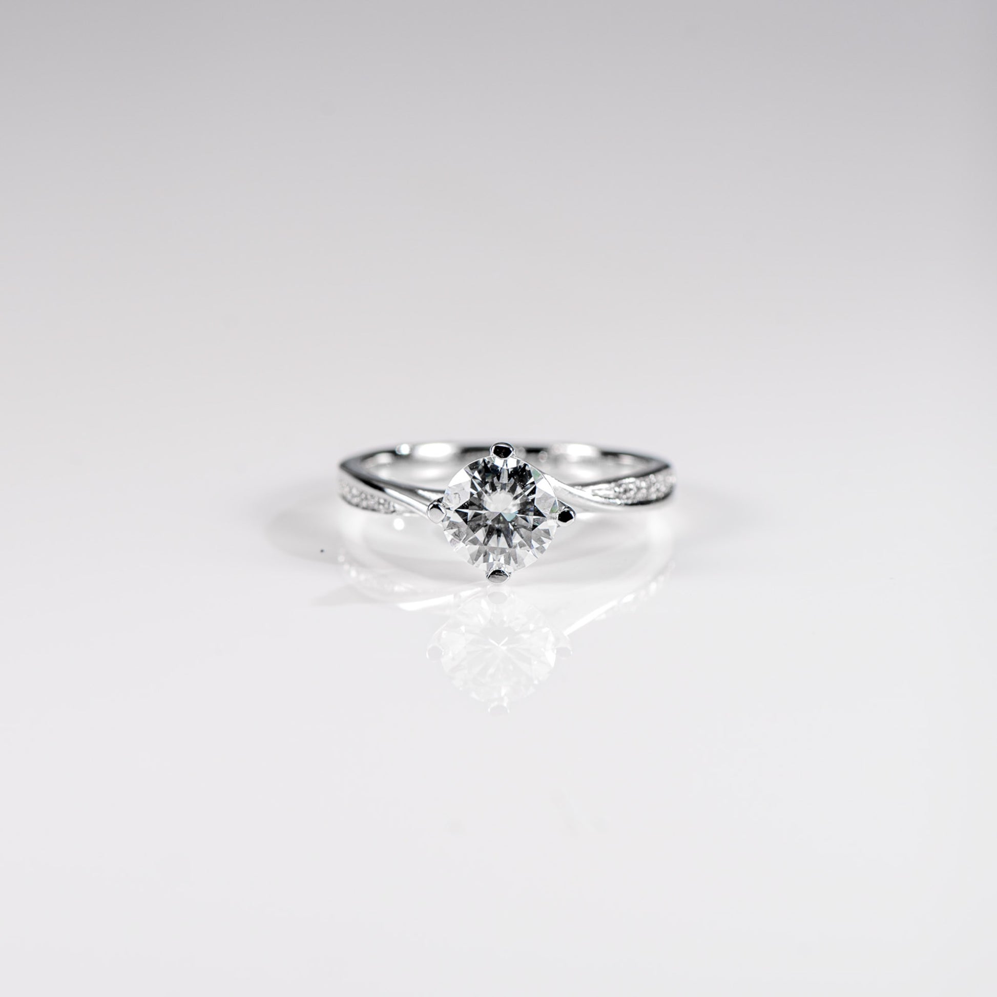 Diamond ring on a light gray background
