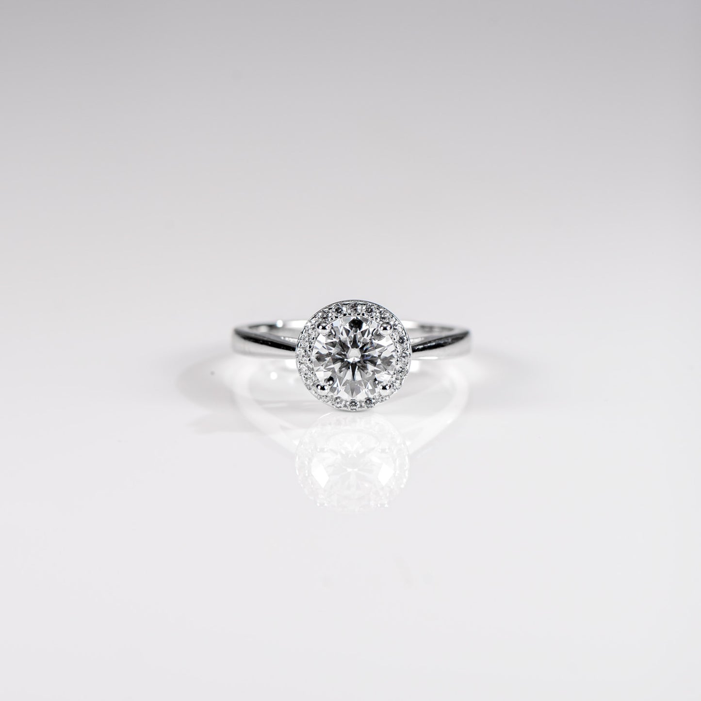 Diamond ring on a light gray background