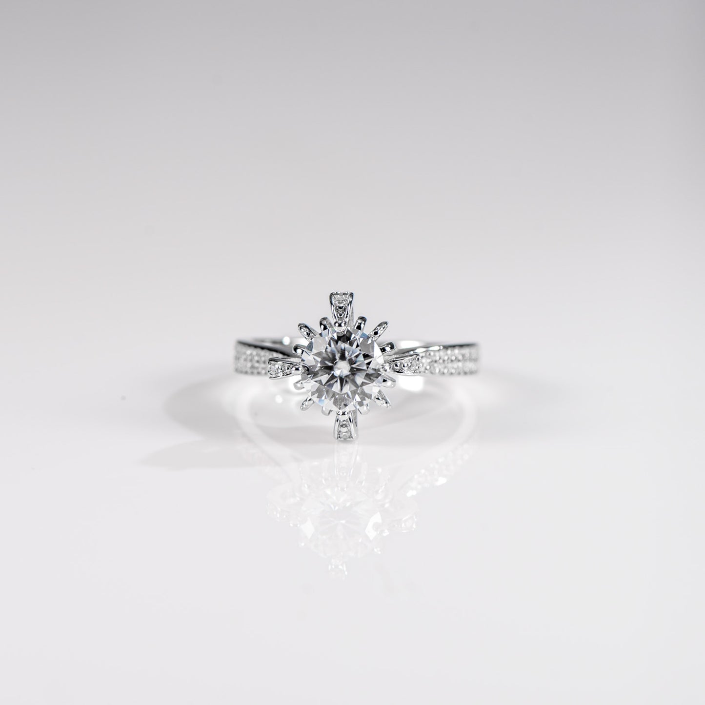 Diamond ring on a light gray background