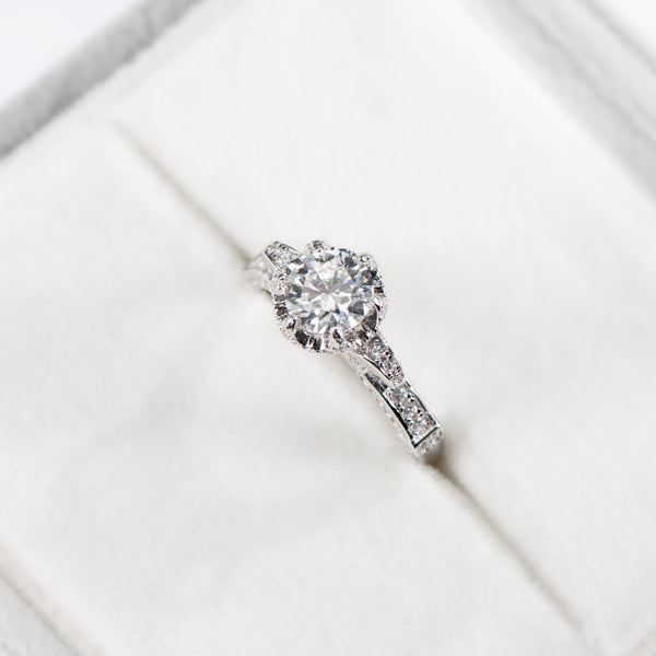 Diamond ring on a white surface