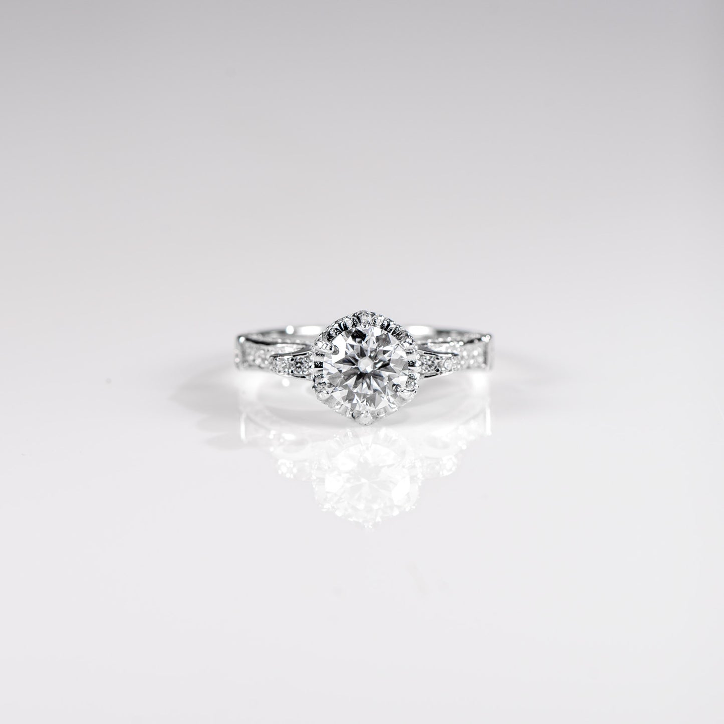 Diamond ring on a light gray background