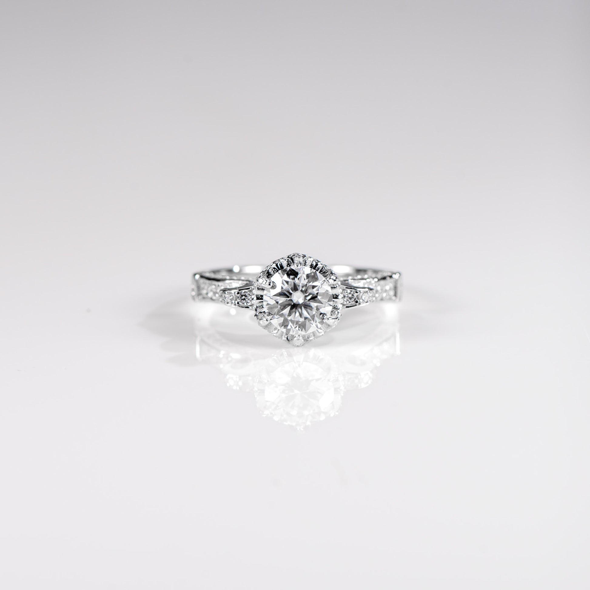 Diamond ring on a light gray background