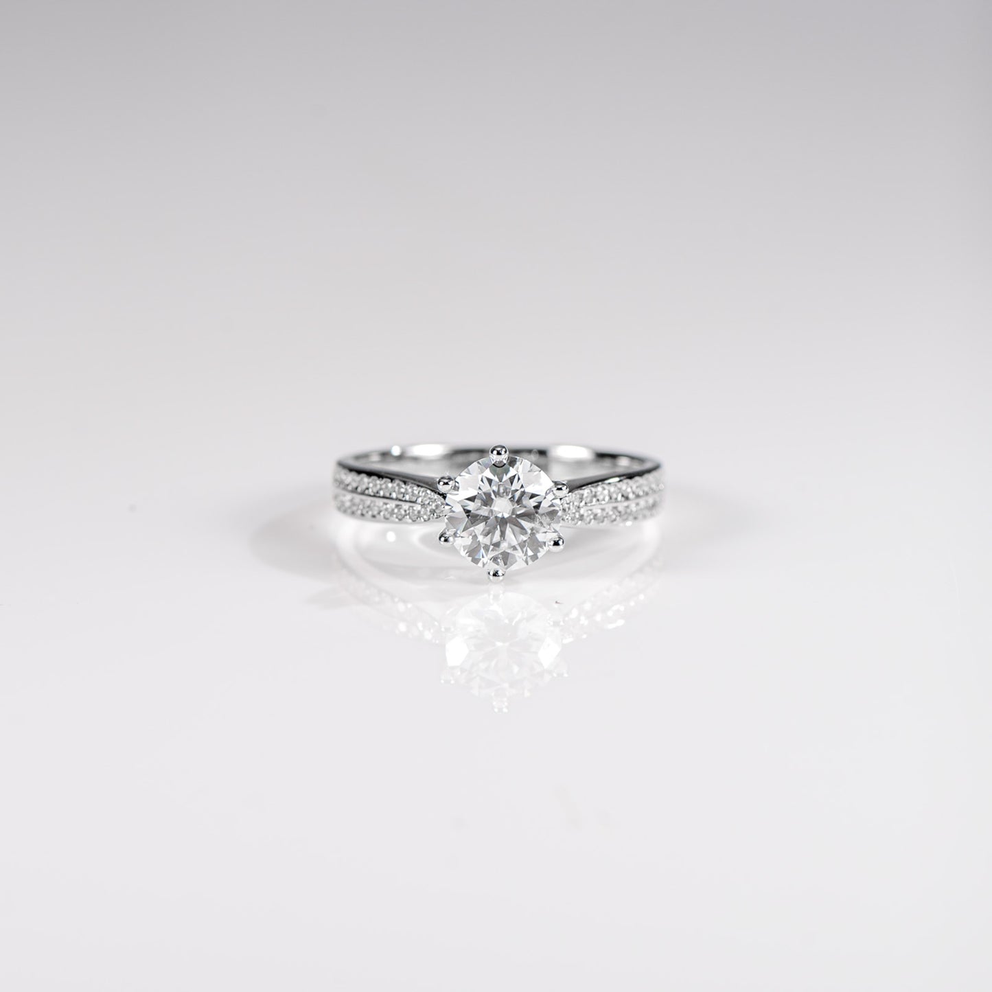 Diamond ring on a light gray background