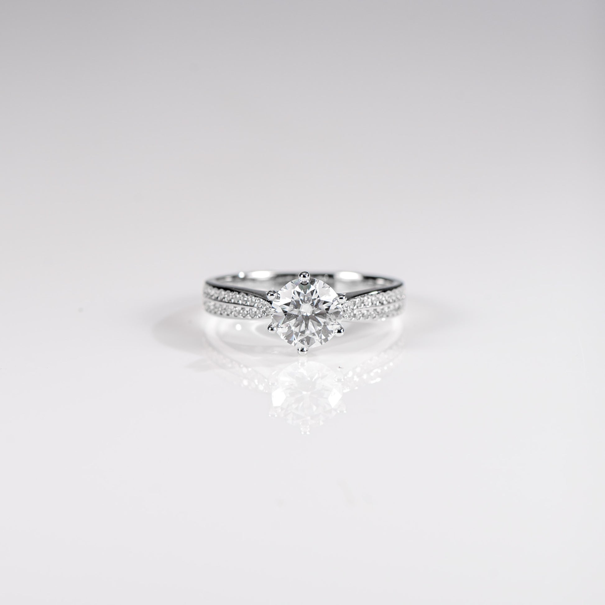 Diamond ring on a light gray background