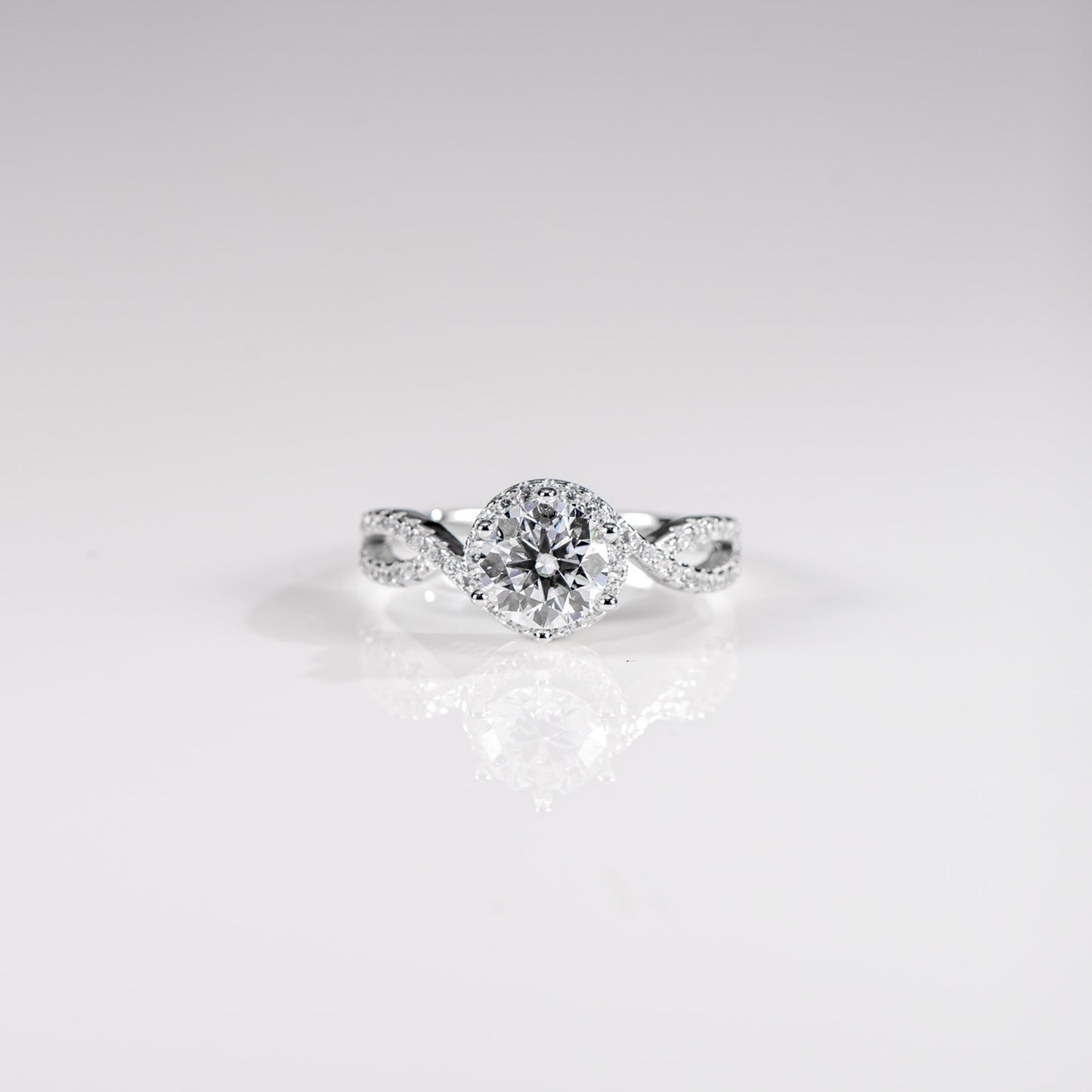 Diamond ring on a light gray background