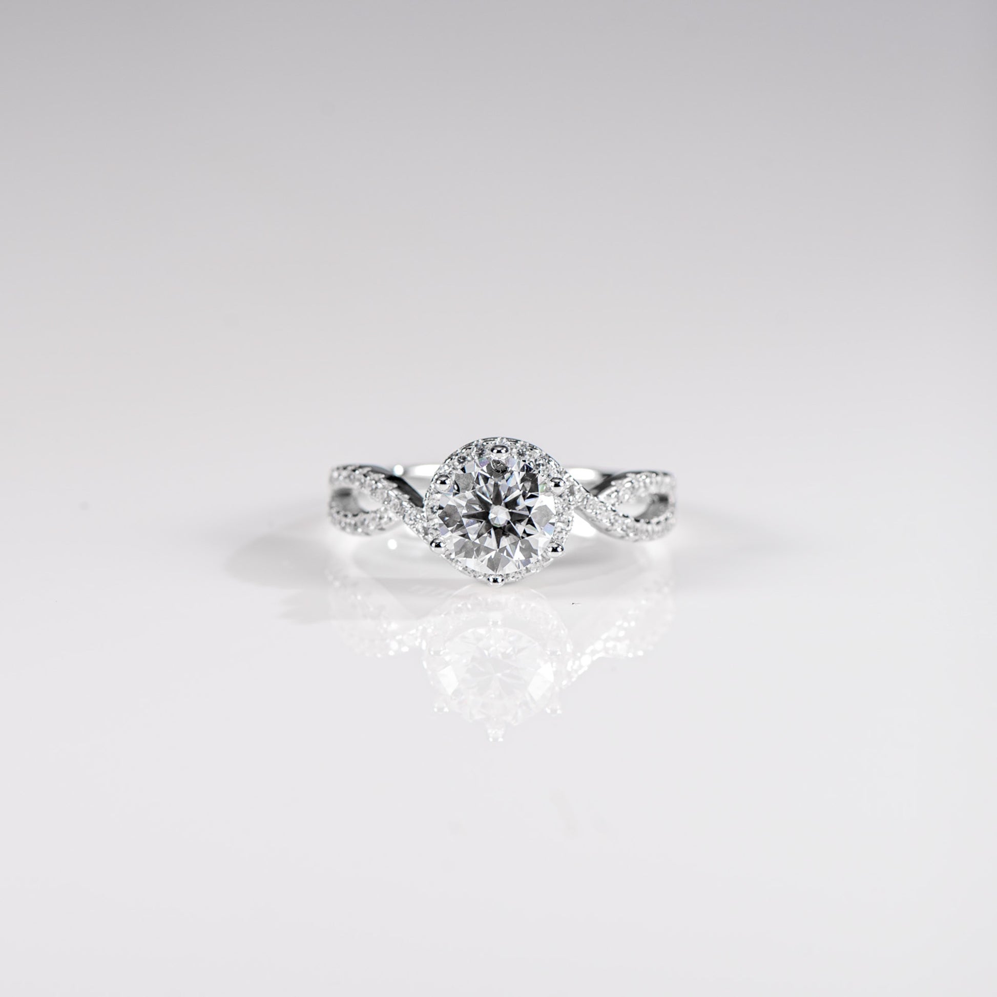 Diamond ring on a light gray background
