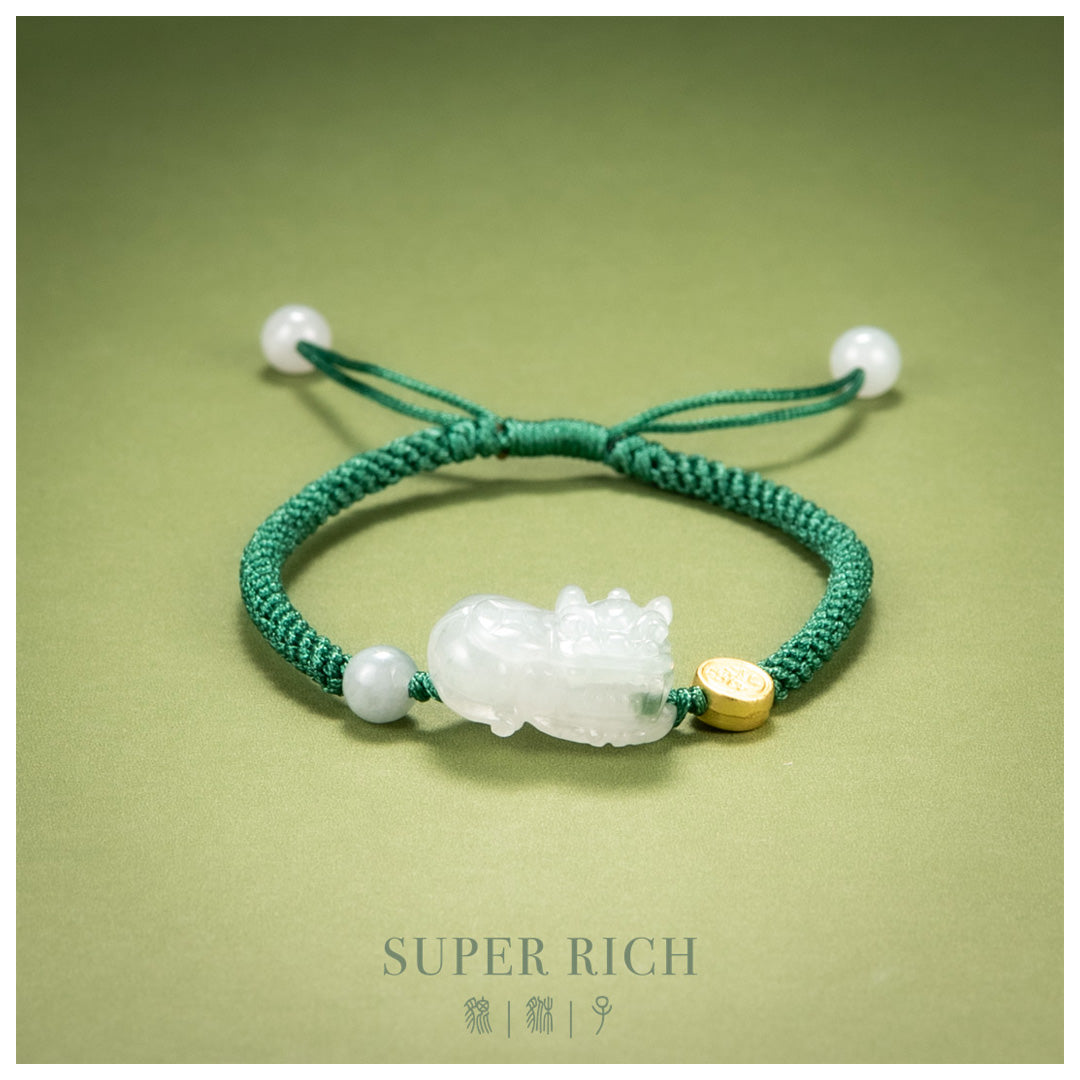 Green bracelet with a white stone and gold accent on a green background
