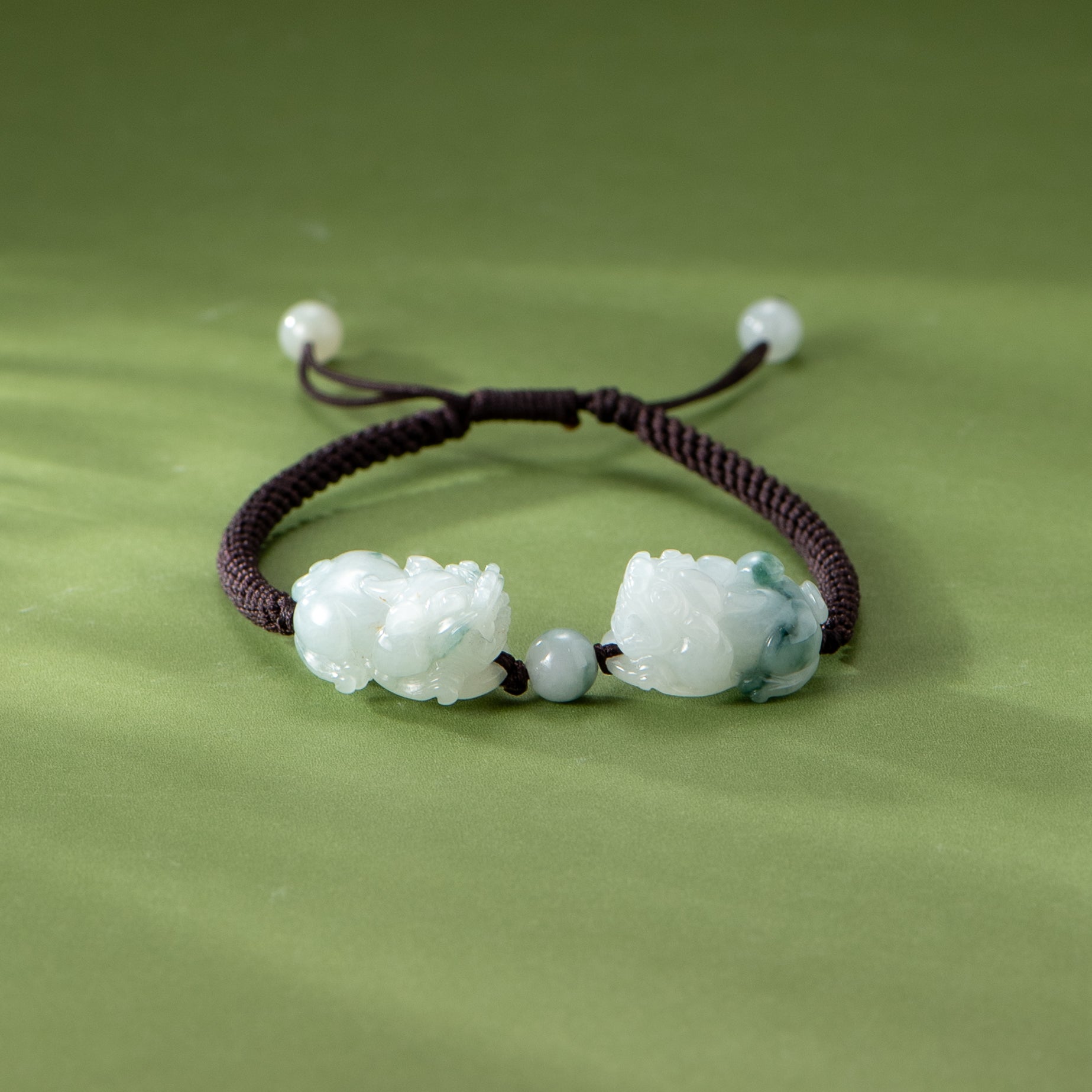 Bracelet with green beads on a green background