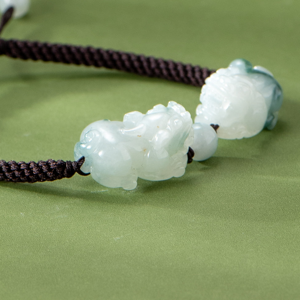 Jadeite bead necklace on a green background