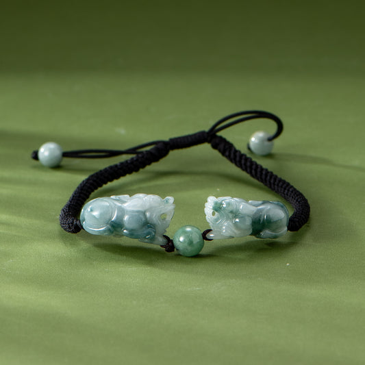 Bracelet with green beads on a green background