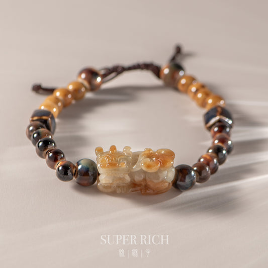 Beaded bracelet with a decorative clasp on a neutral background, featuring the brand 'Super Rich'.