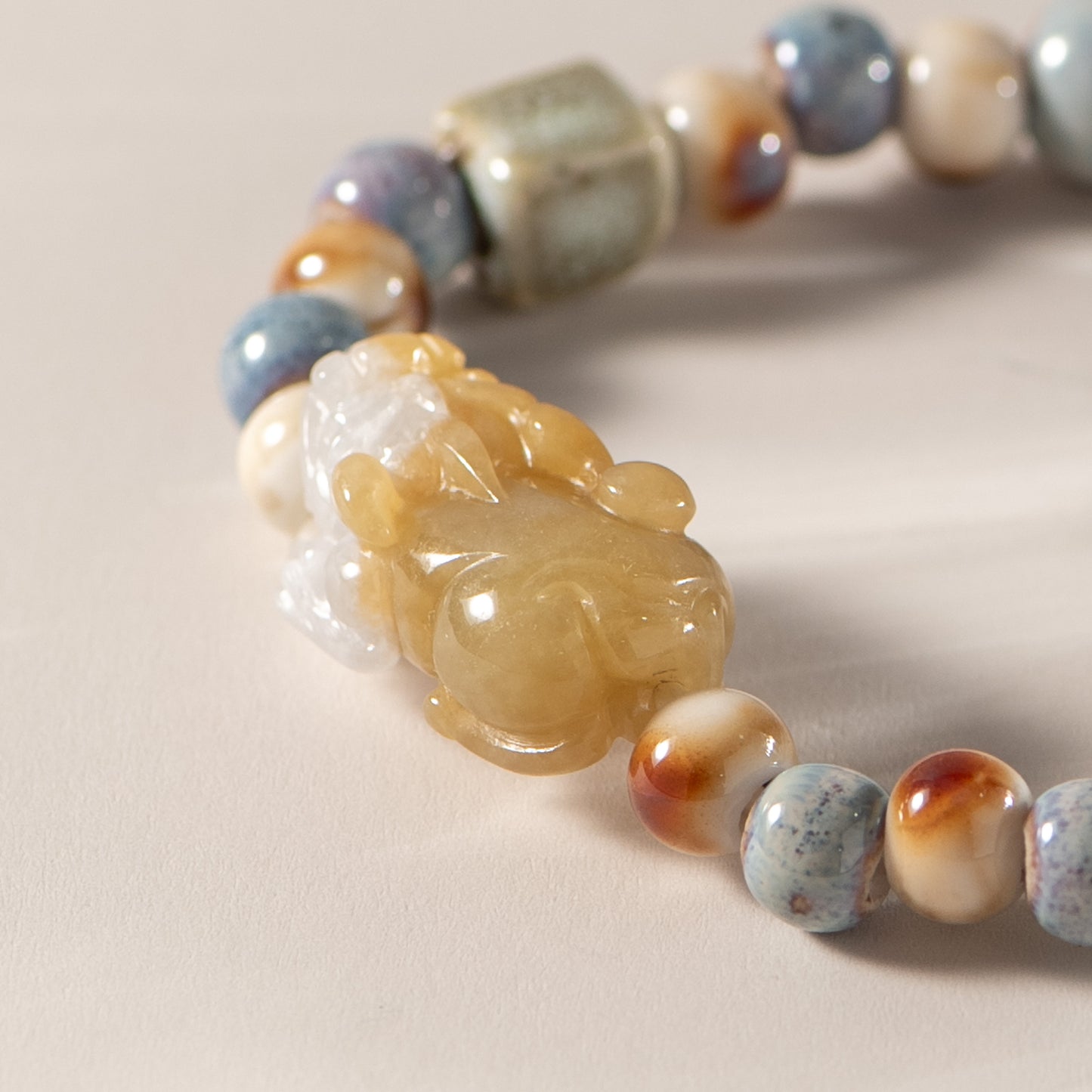 Jewelry with multicolored beads on a beige background