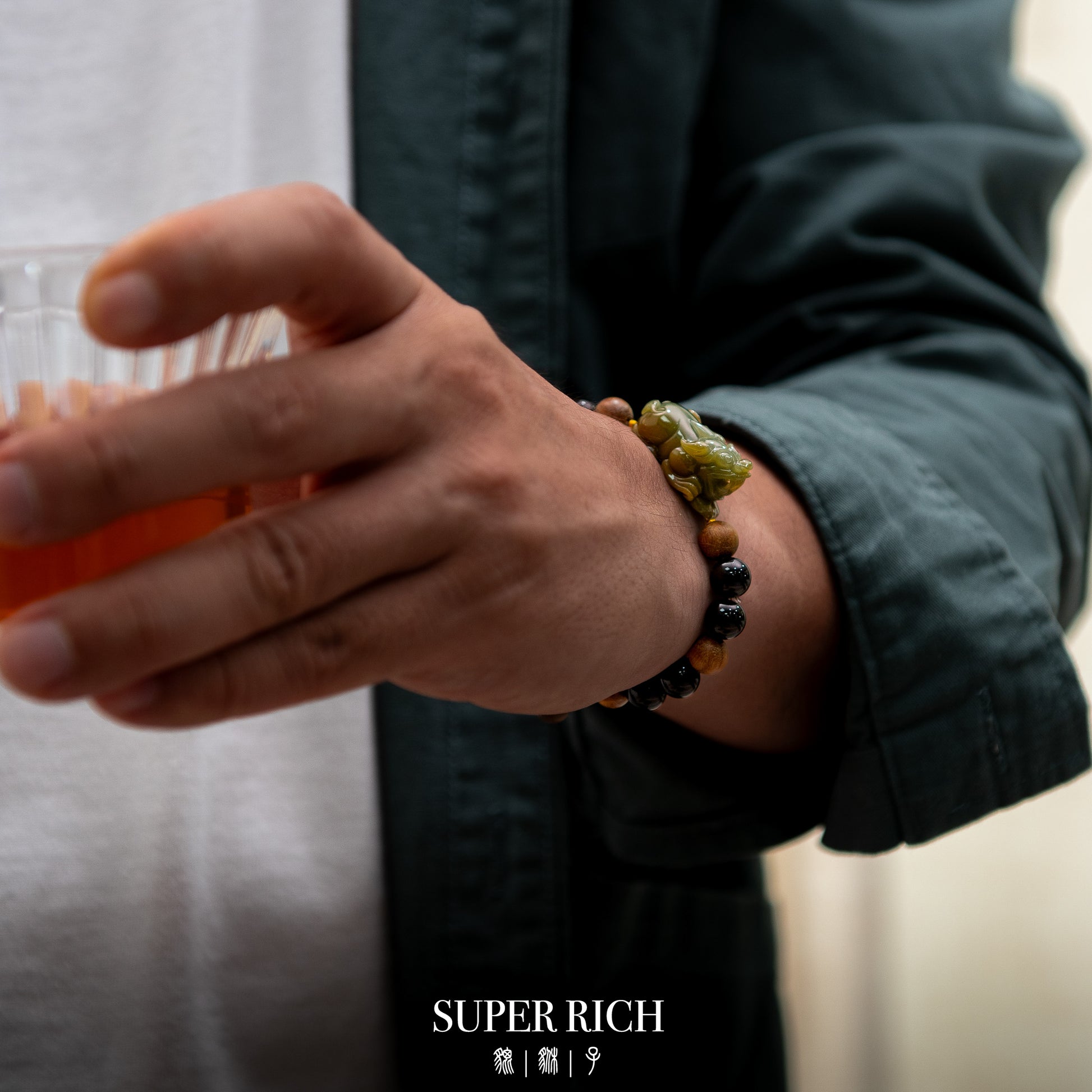 Person wearing a beaded bracelet with a blurred background