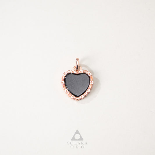 Heart-shaped pendant with rose gold frame on a white background, Solara Oro brand visible.