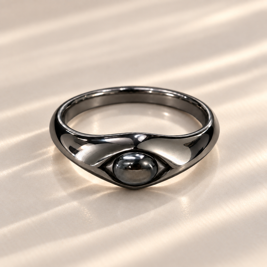 Black star sapphire oval cabochon ring in 925 sterling silver, front view