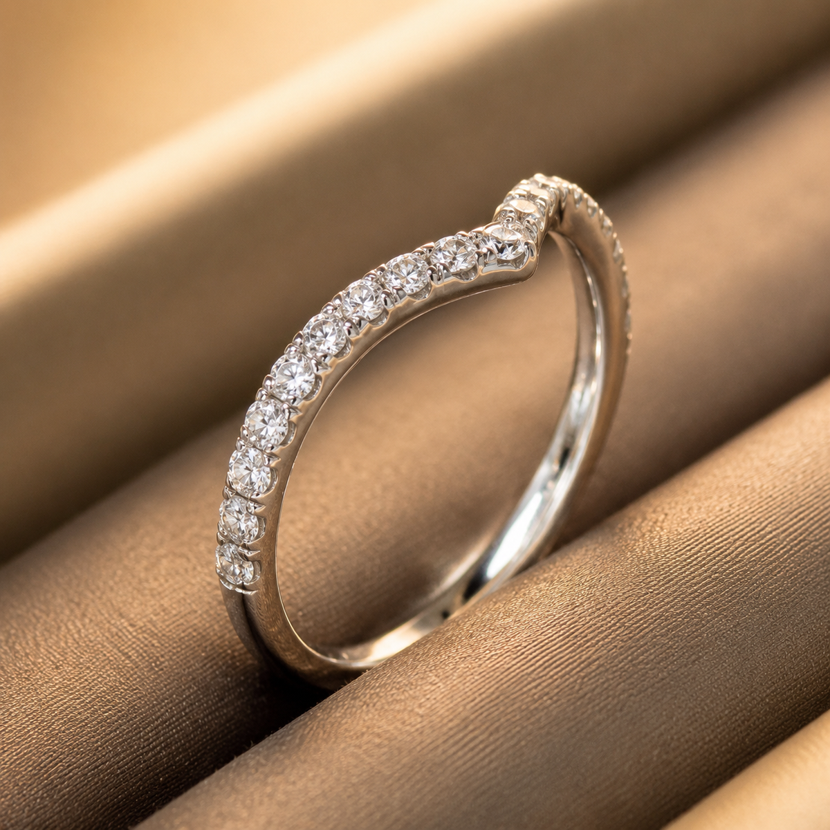 Kairos pavé diamond chevron ring — standing profile view in a ring box