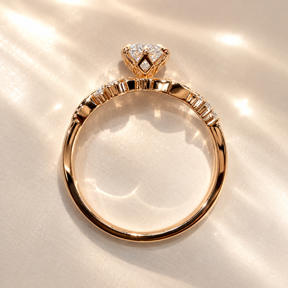 Top-down view through the band of Majesté de Nuit diamond ring, showing the round centre stone and pavé shoulder stones