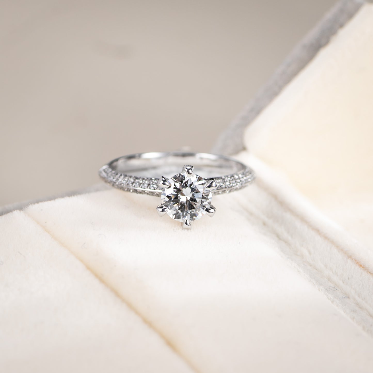 Diamond ring on a soft white surface