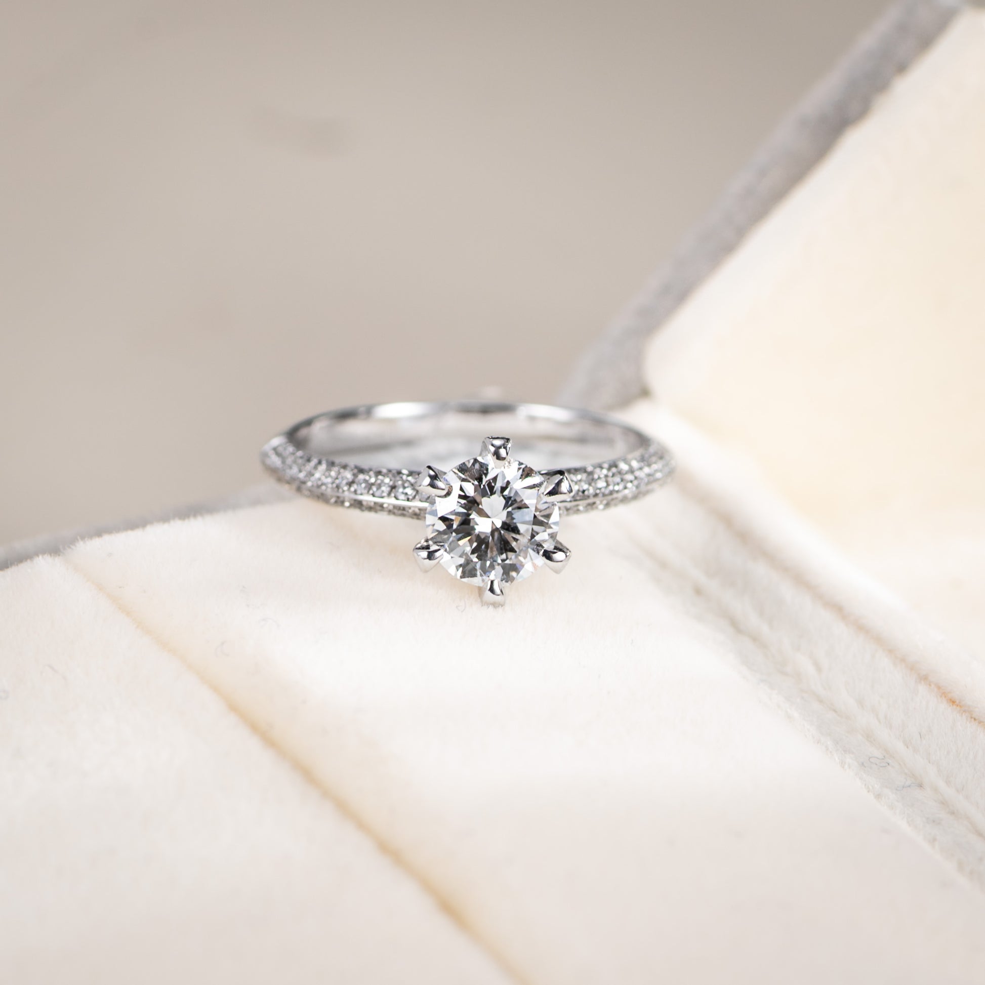 Diamond ring on a soft white surface