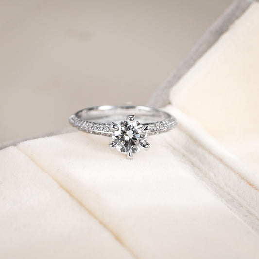 Diamond ring on a soft white surface