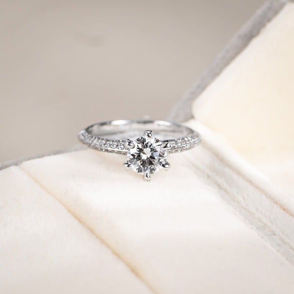 Diamond ring on a soft white surface