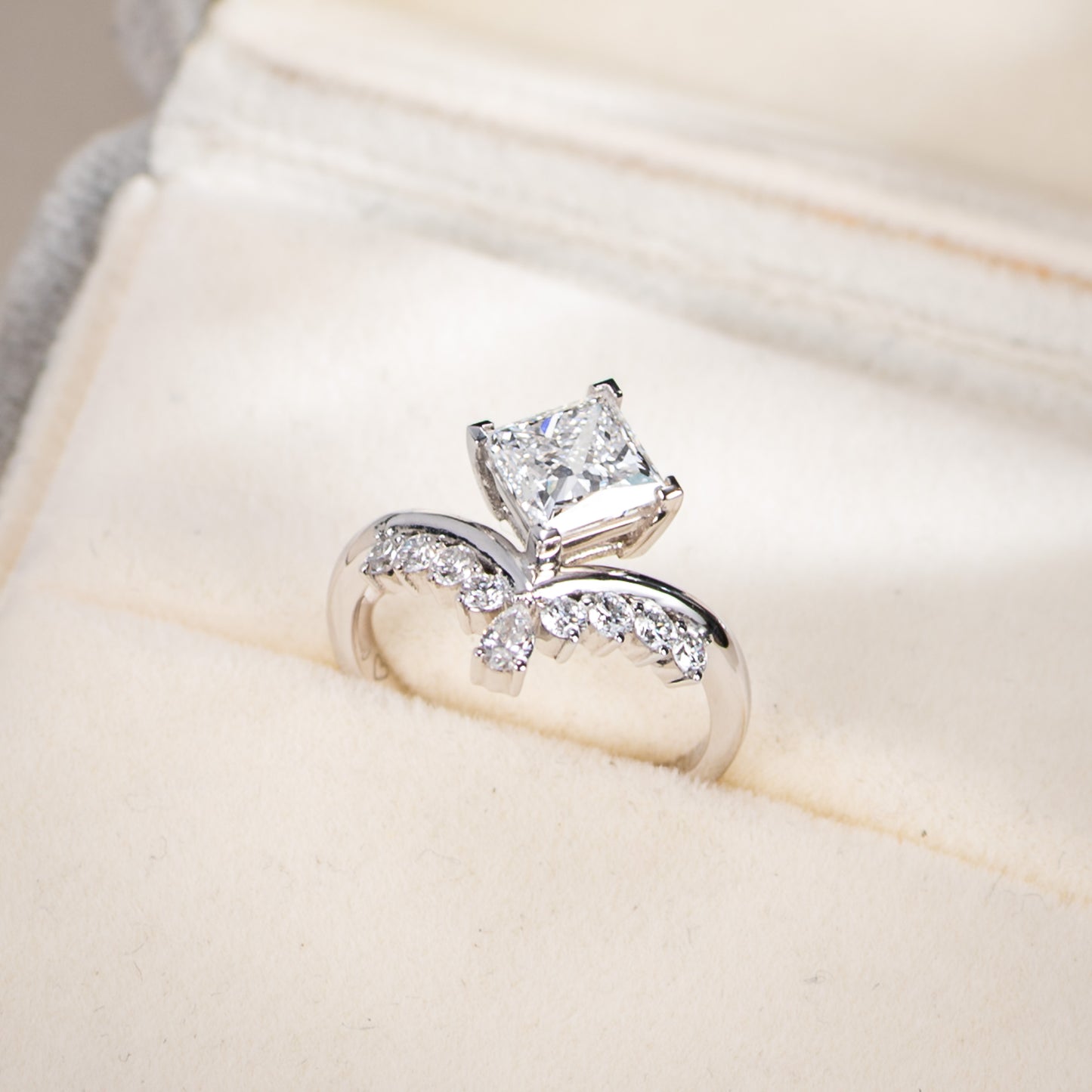 Diamond ring on a soft beige fabric background