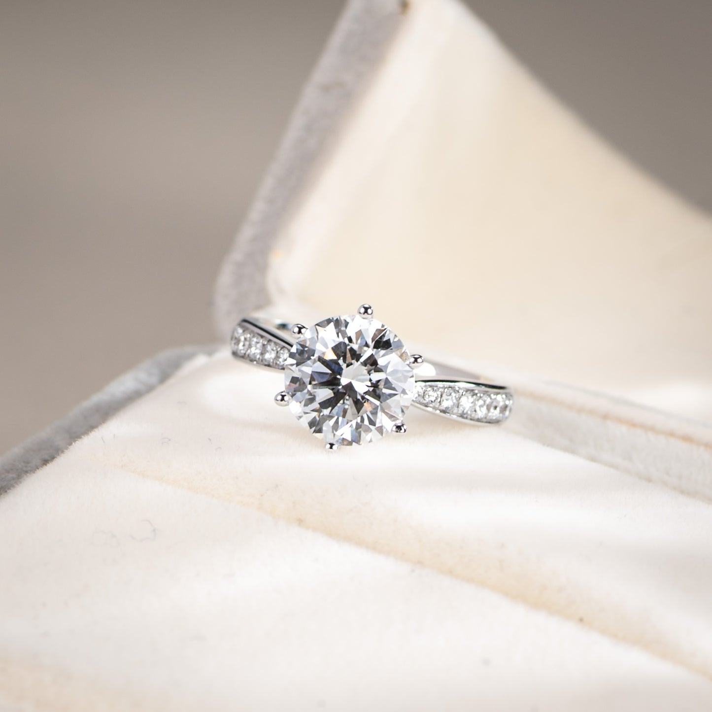 Diamond ring on a soft fabric background