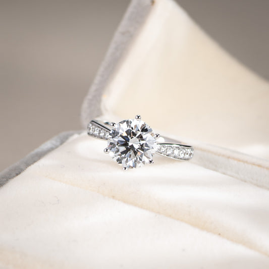 Diamond ring on a soft fabric background