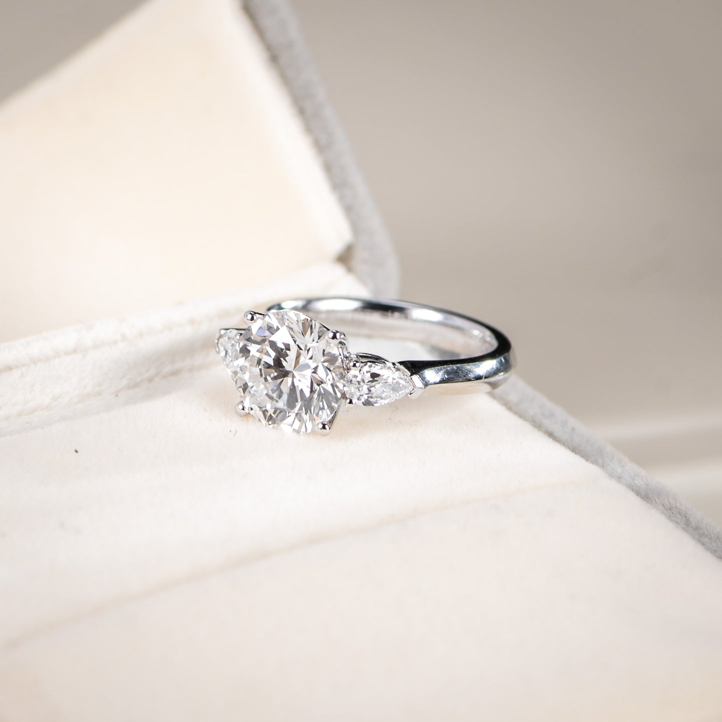 Diamond ring on a soft fabric background