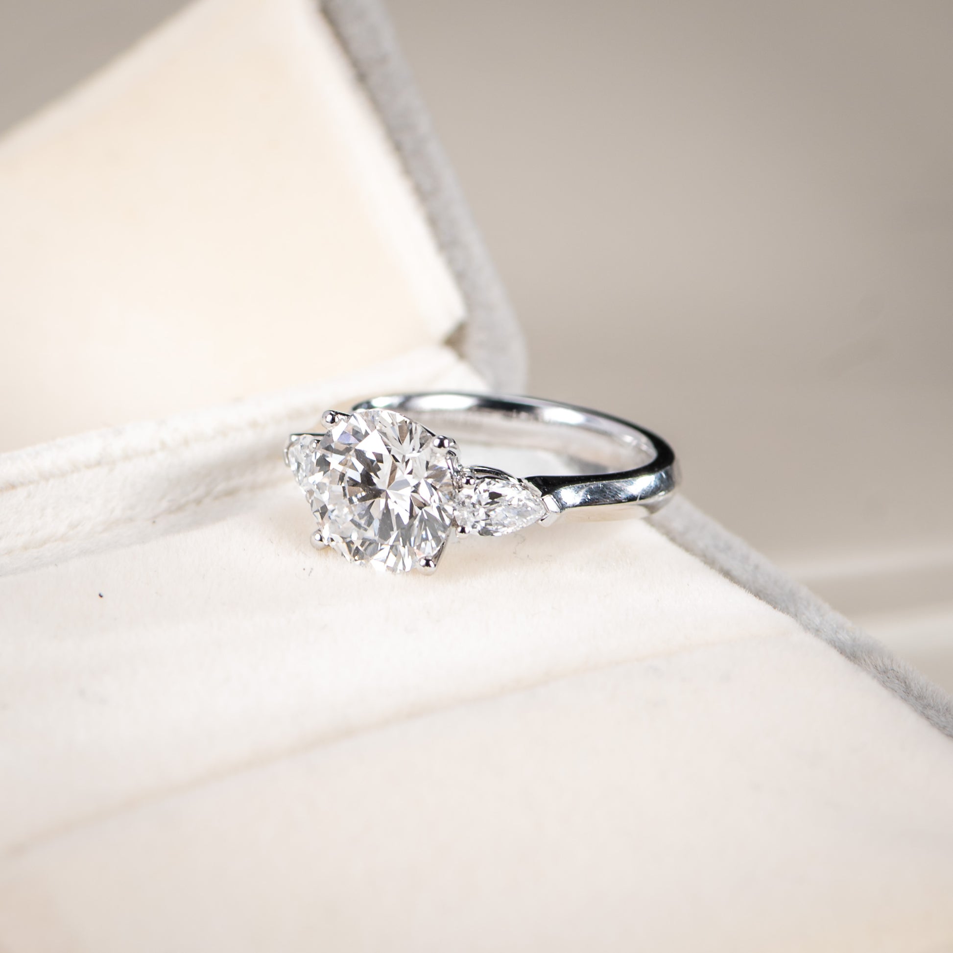 Diamond ring on a soft fabric background