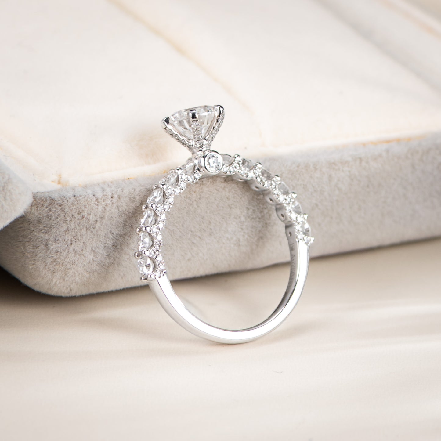 Diamond ring on a soft fabric background