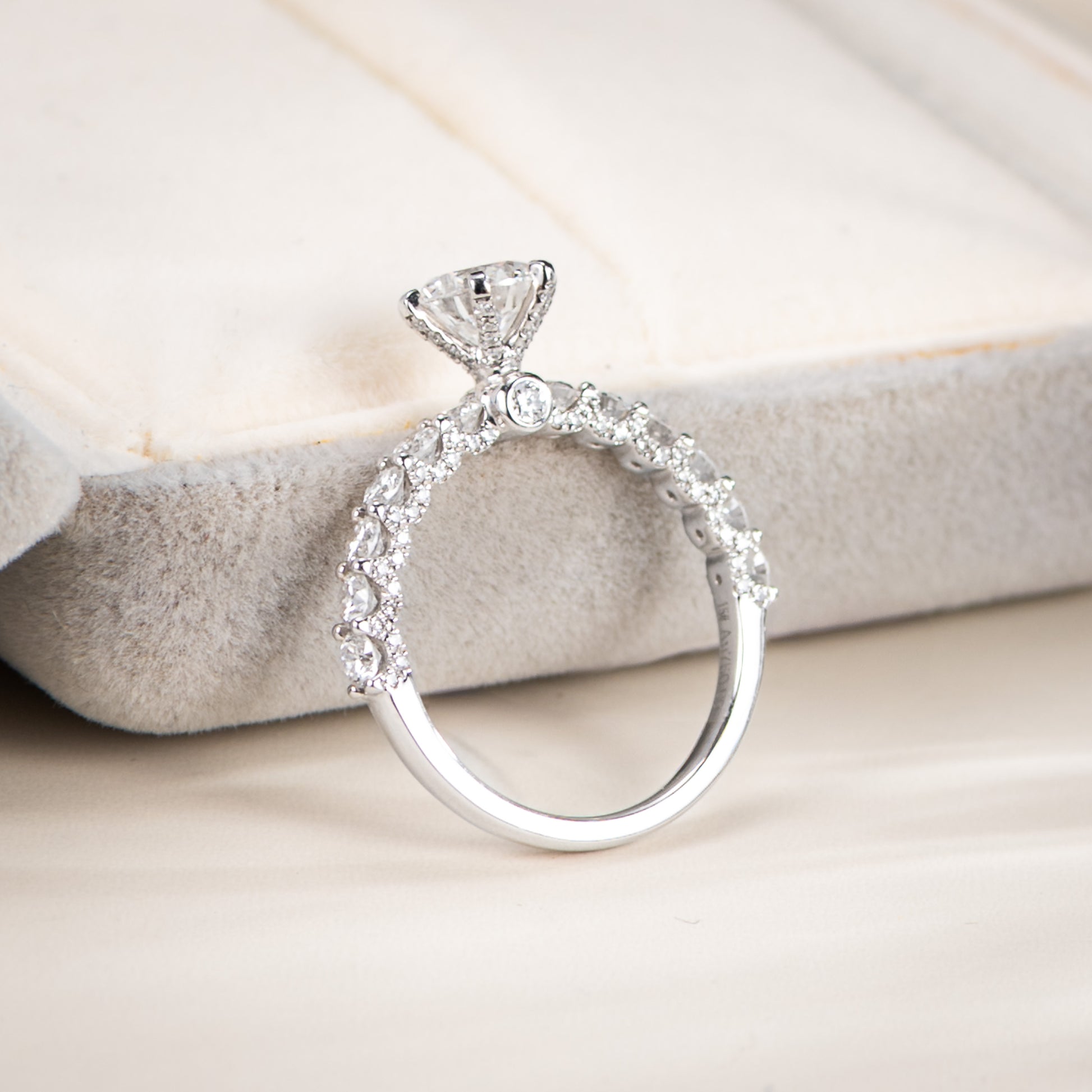 Diamond ring on a soft fabric background
