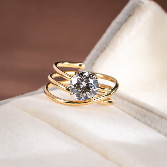 Gold ring with a diamond on a soft surface